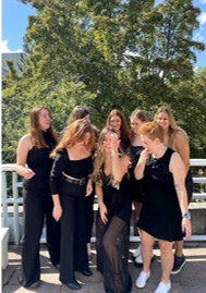Panhellenic recruitment leaders in black dresses