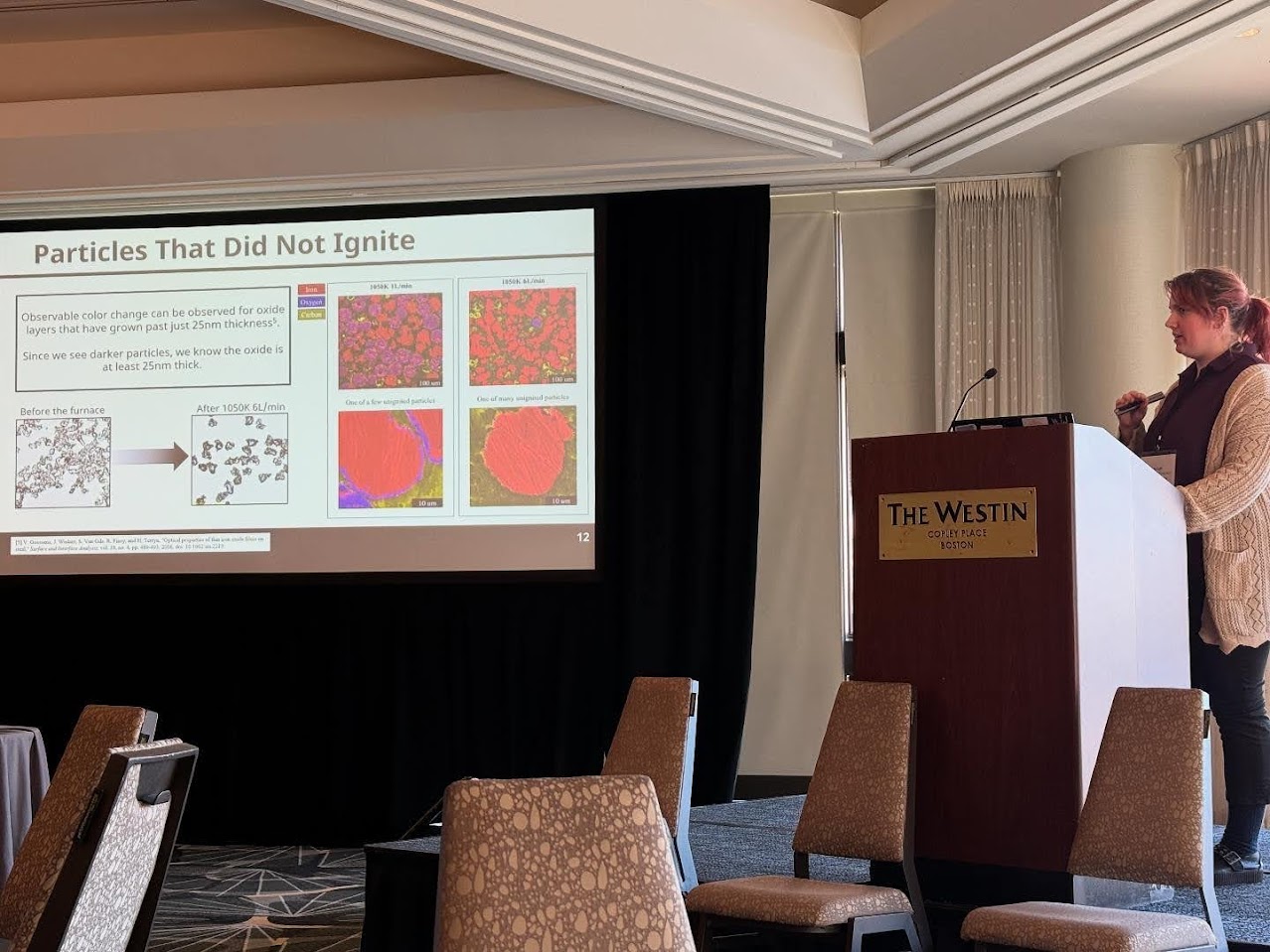 Echo presenting research at conference podium